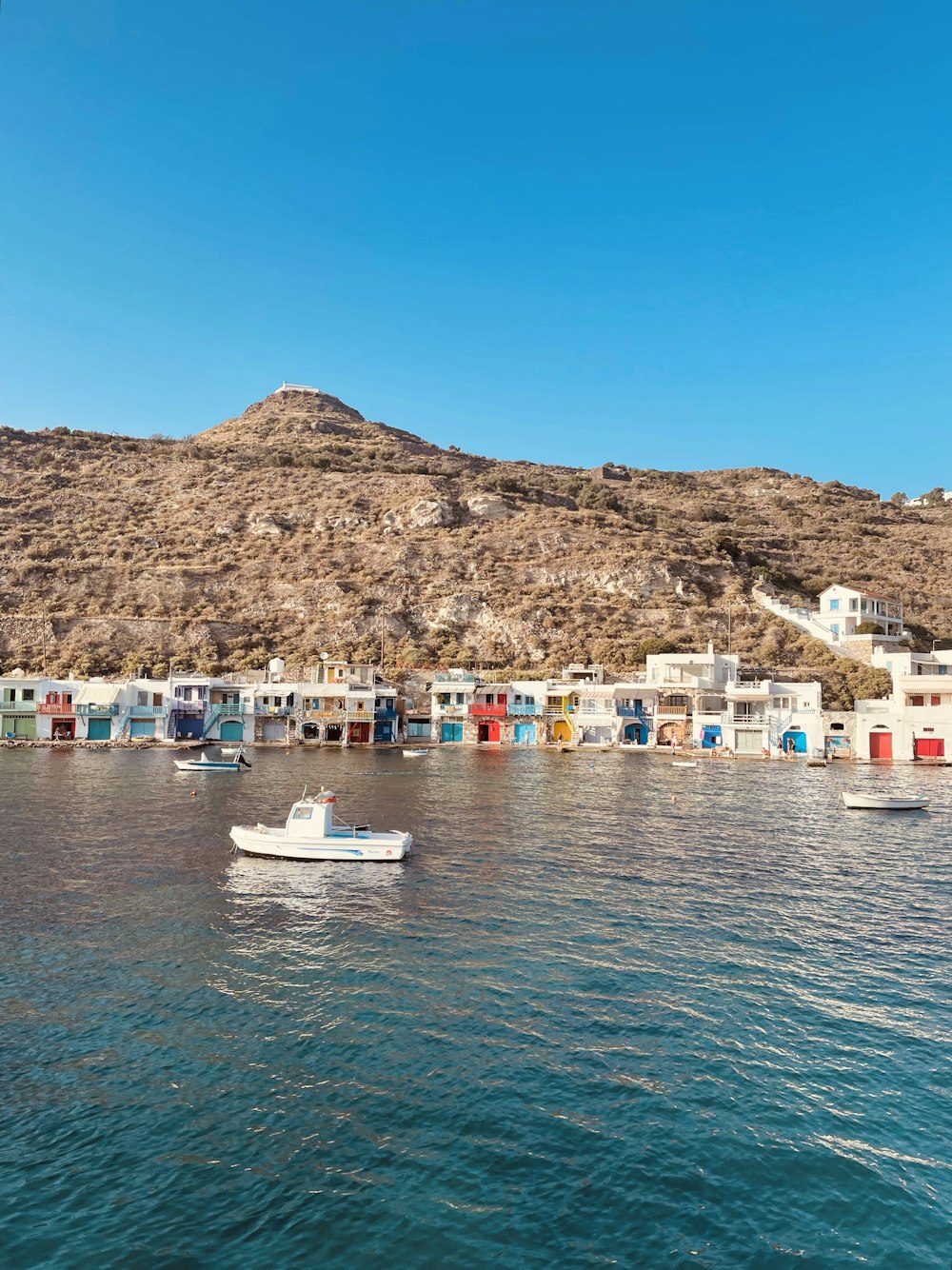 a group of boats floating on top of a body of water