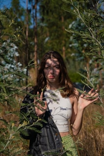 A model wearing a minimalist yet elegant uyan jacket outdoors in soft natural light.