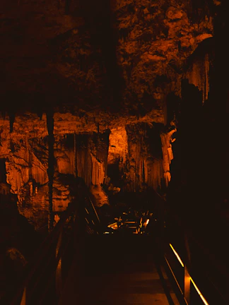 Mystical cave passageway softly illuminated by warm, ambient lighting.
