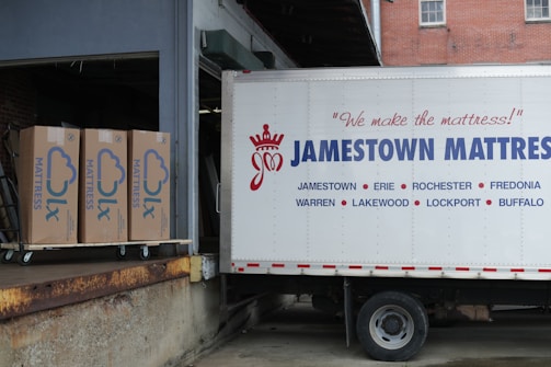 a truck parked in front of a brick building