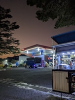 Night view of mobile diesel fuel trucks with company branding in Sharjah
