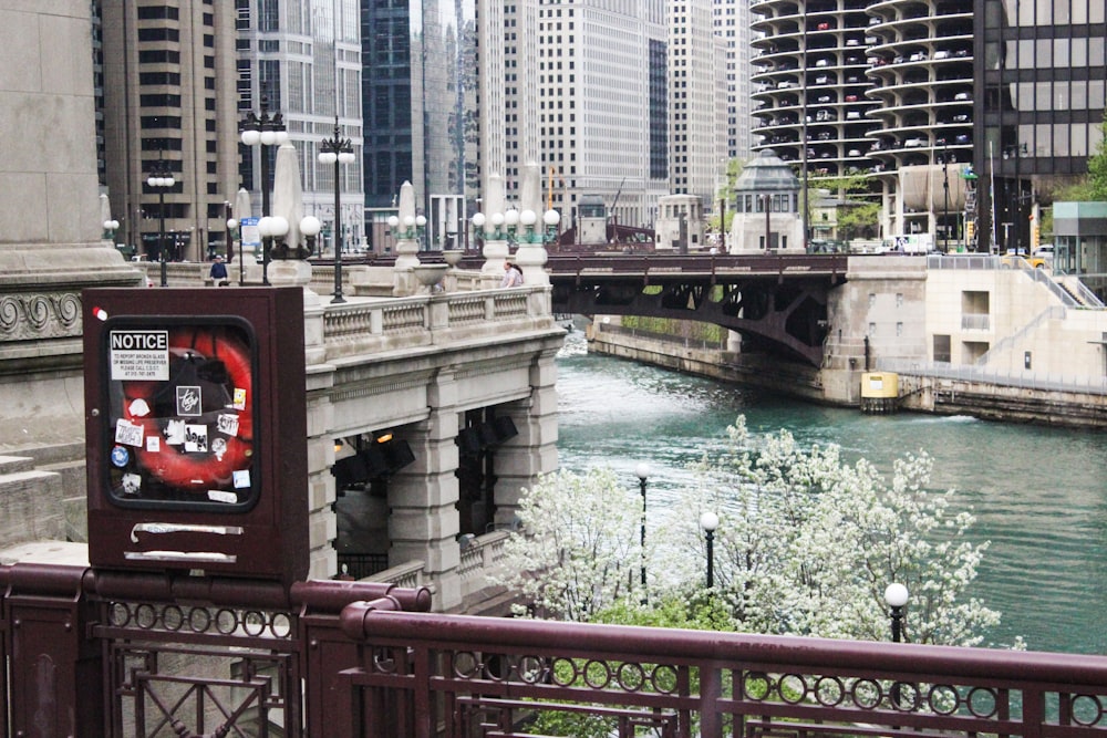 a bridge over a river next to tall buildings