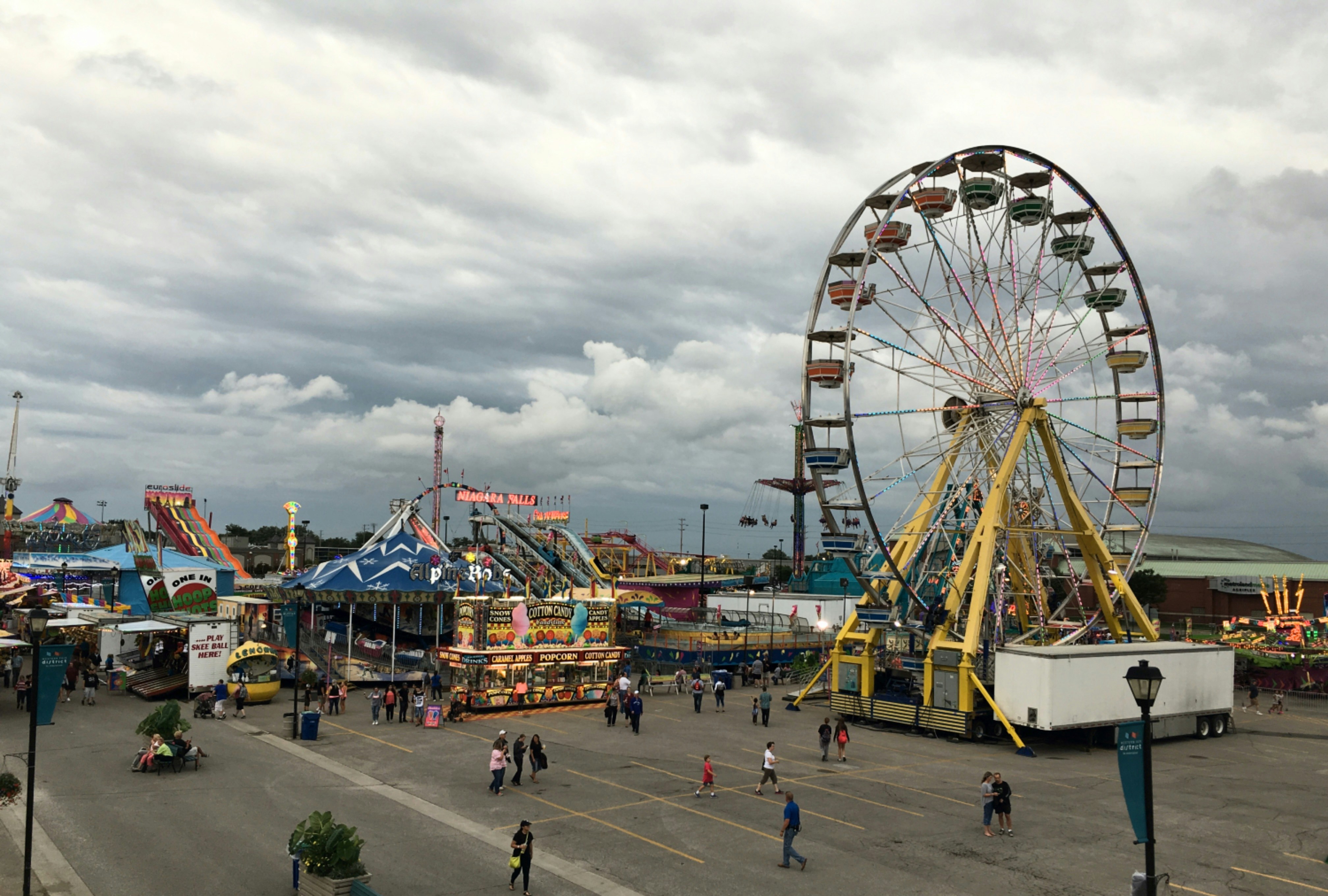 an amusement park with a ferris wheel and rides