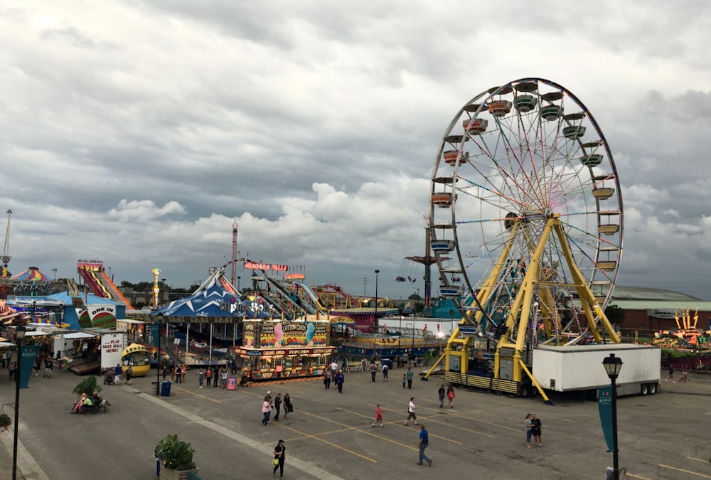 an amusement park with a ferris wheel and rides