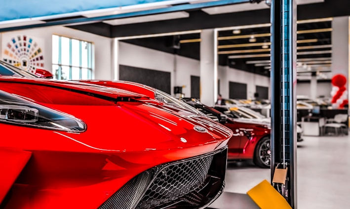 a red sports car parked in a garage