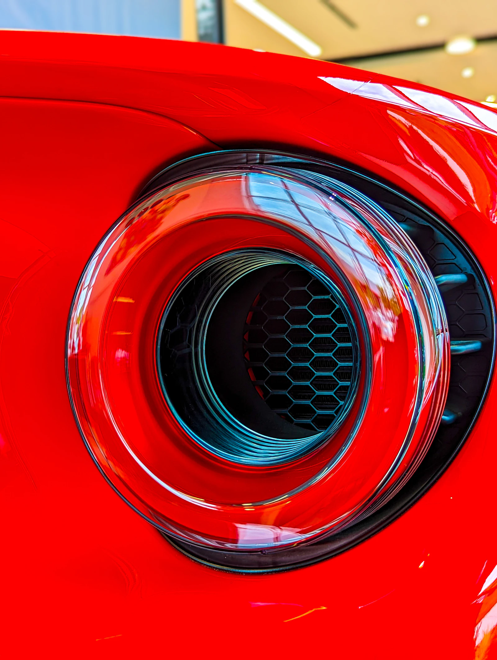 Close up of a car's rear exhaust pipe and muffler
