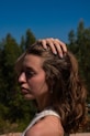 a woman with her hair in the wind