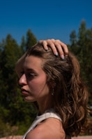 a woman with her hair in the wind
