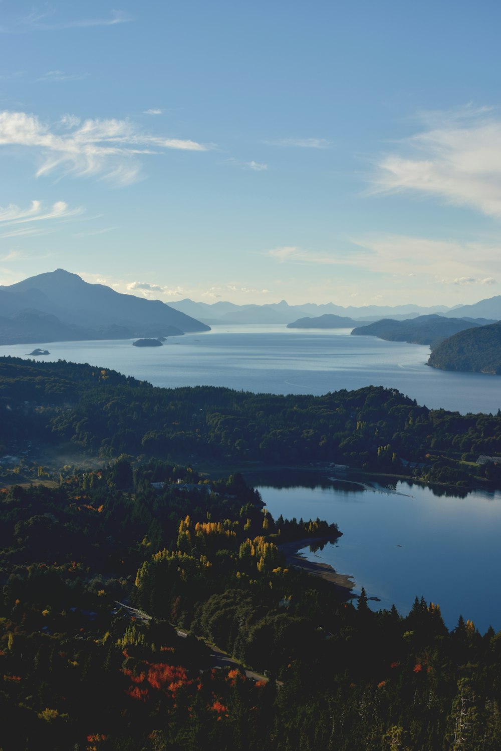 a scenic view of a lake surrounded by mountains