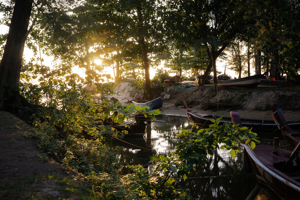 a group of boats sitting on top of a river