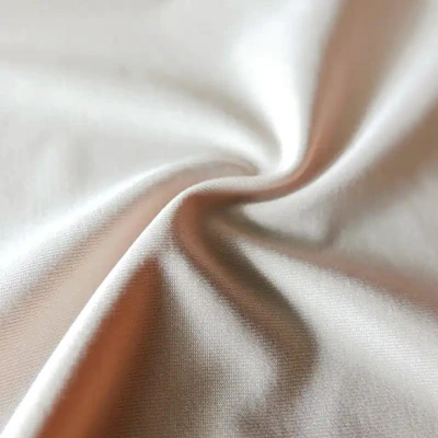 A close-up of the Just Bee duality activewear set fabric showing its smooth texture in soft natural light.