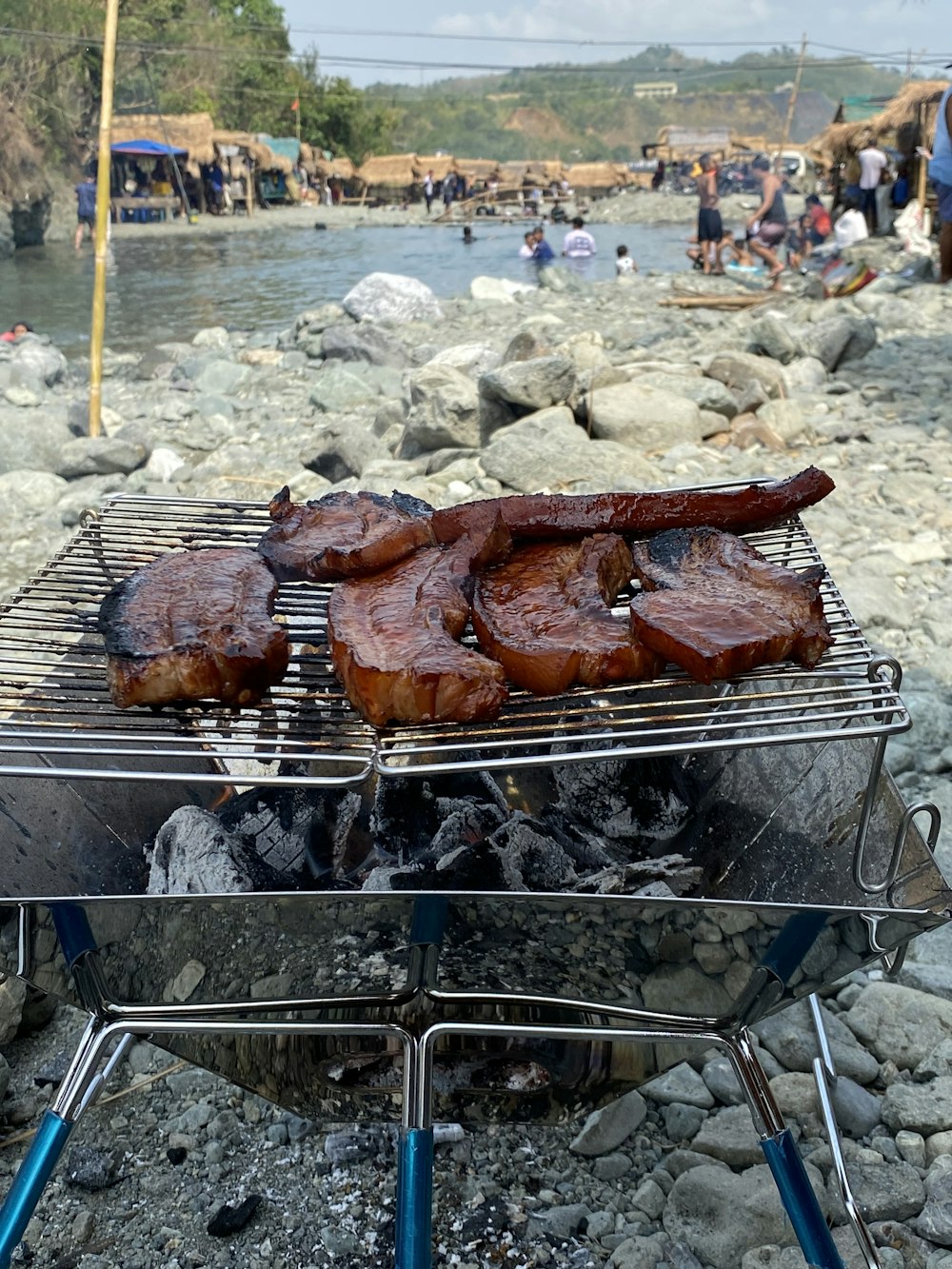 a grill that has some meat on it