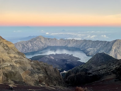 a view of a mountain range with a lake in the middle
