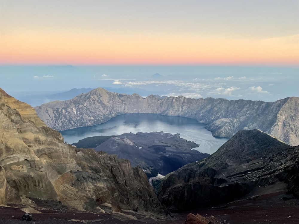 a view of a mountain range with a lake in the middle