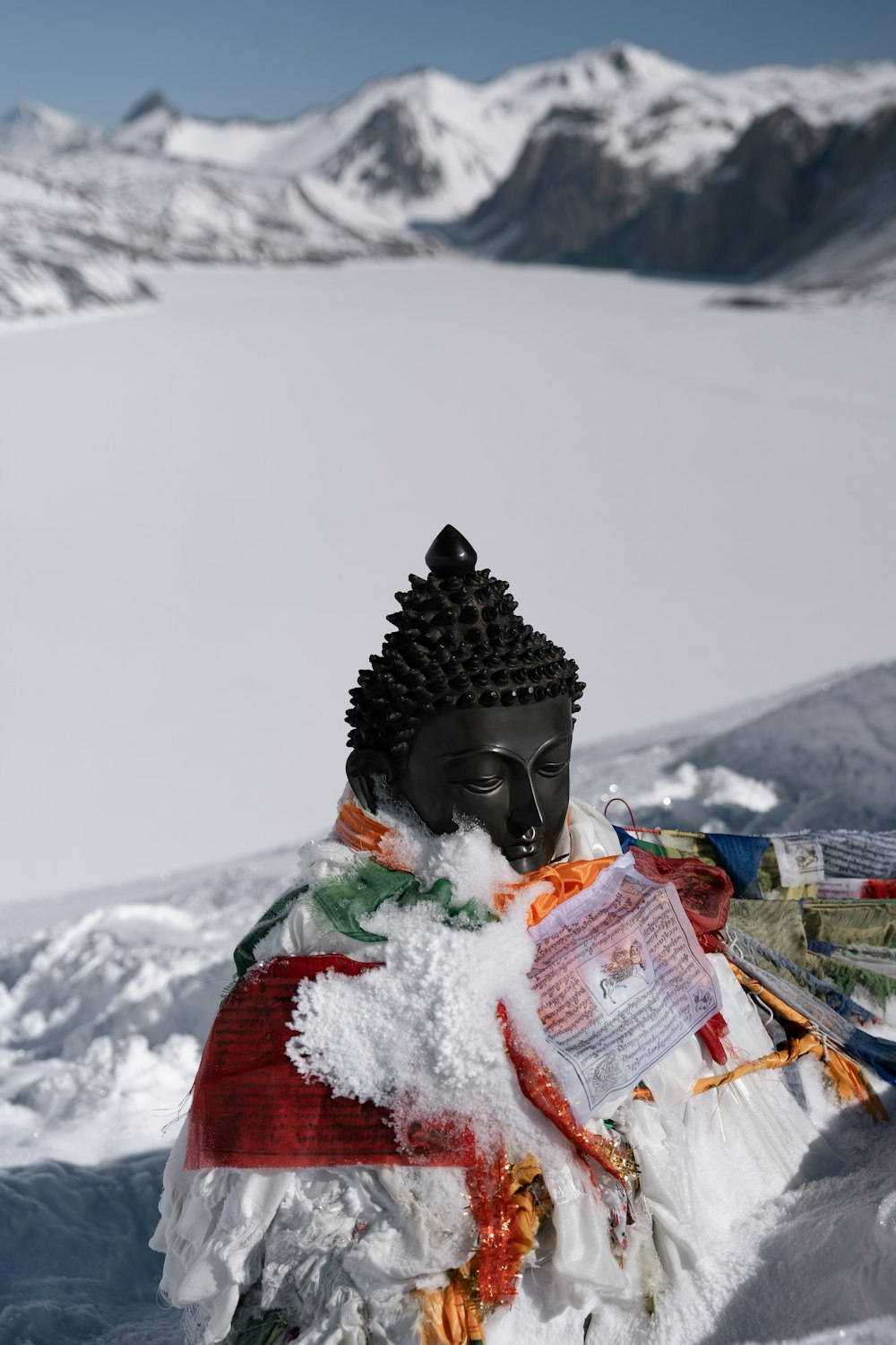 a statue of a person covered in snow