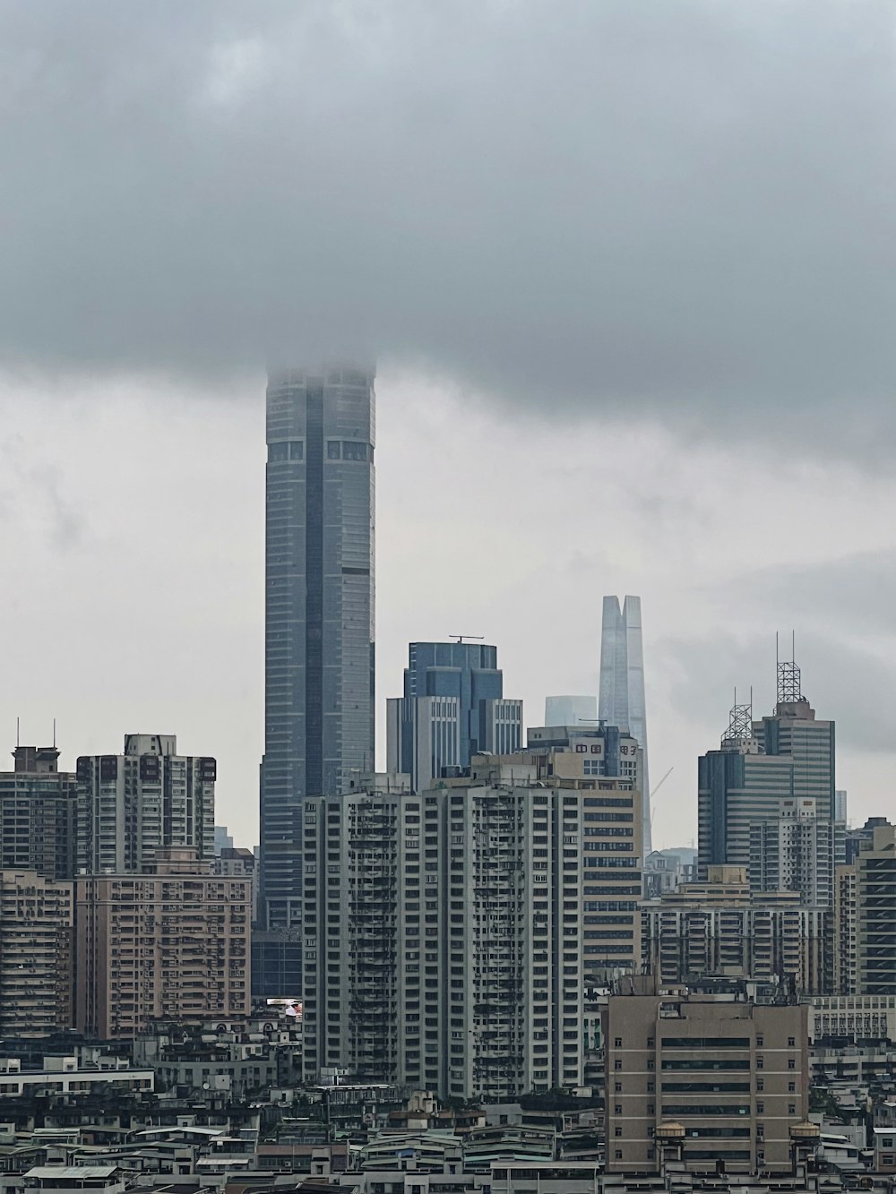 a large city with a very tall building in the background