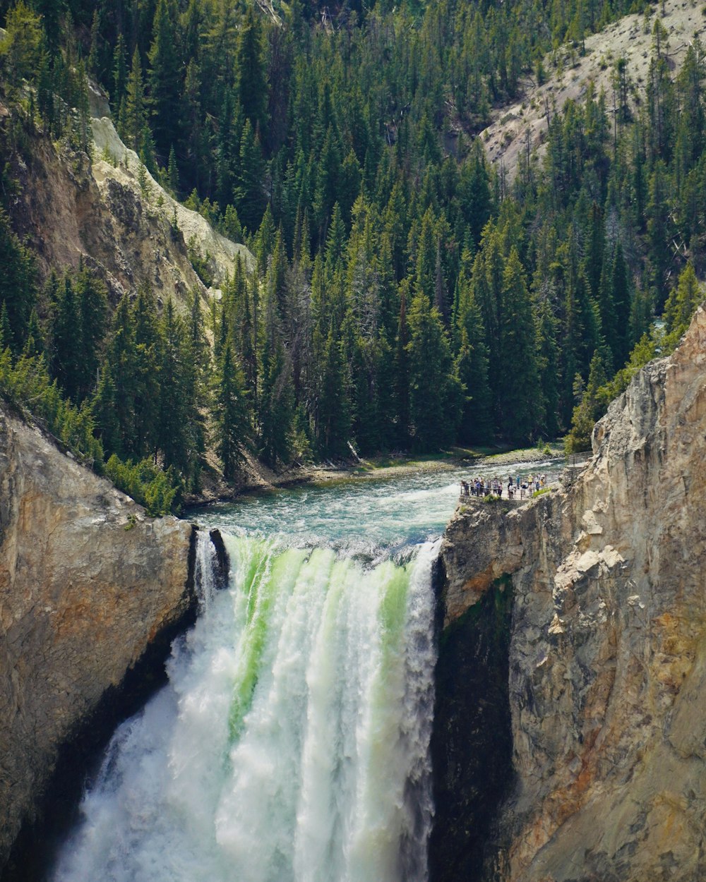 a large waterfall with water coming out of it