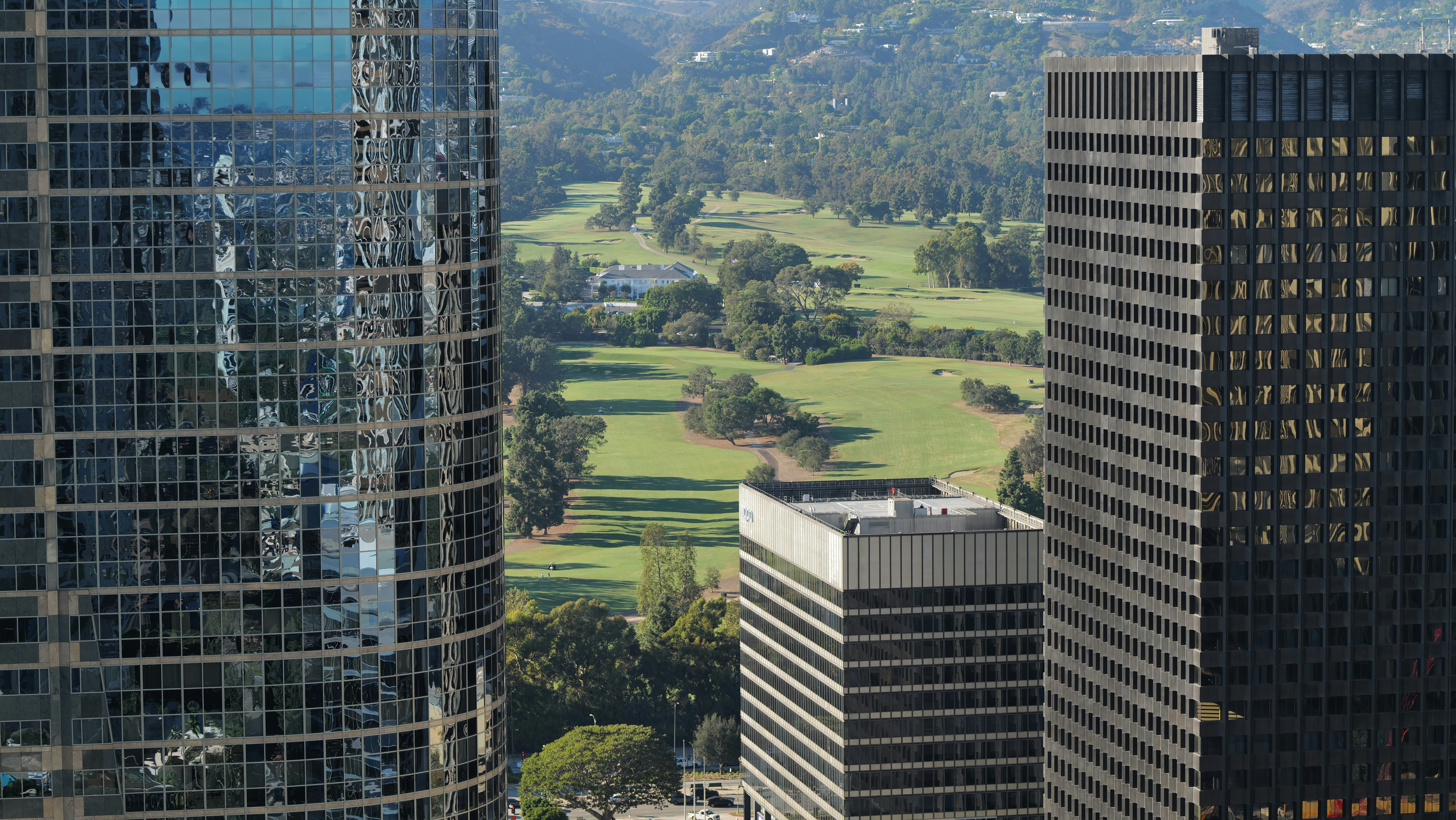 a couple of tall buildings sitting next to each other