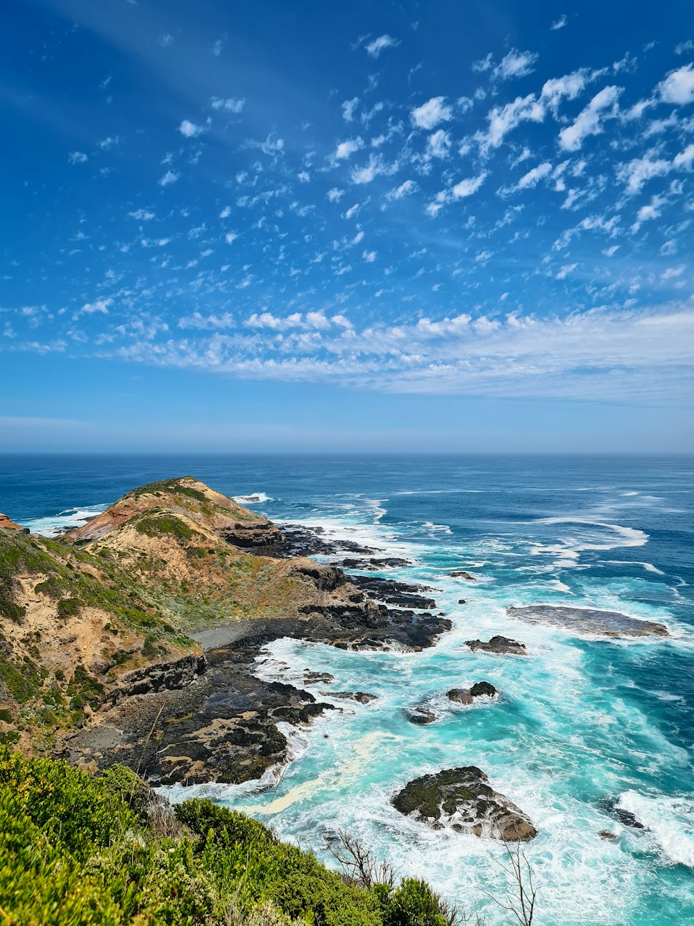 a view of the ocean from a cliff