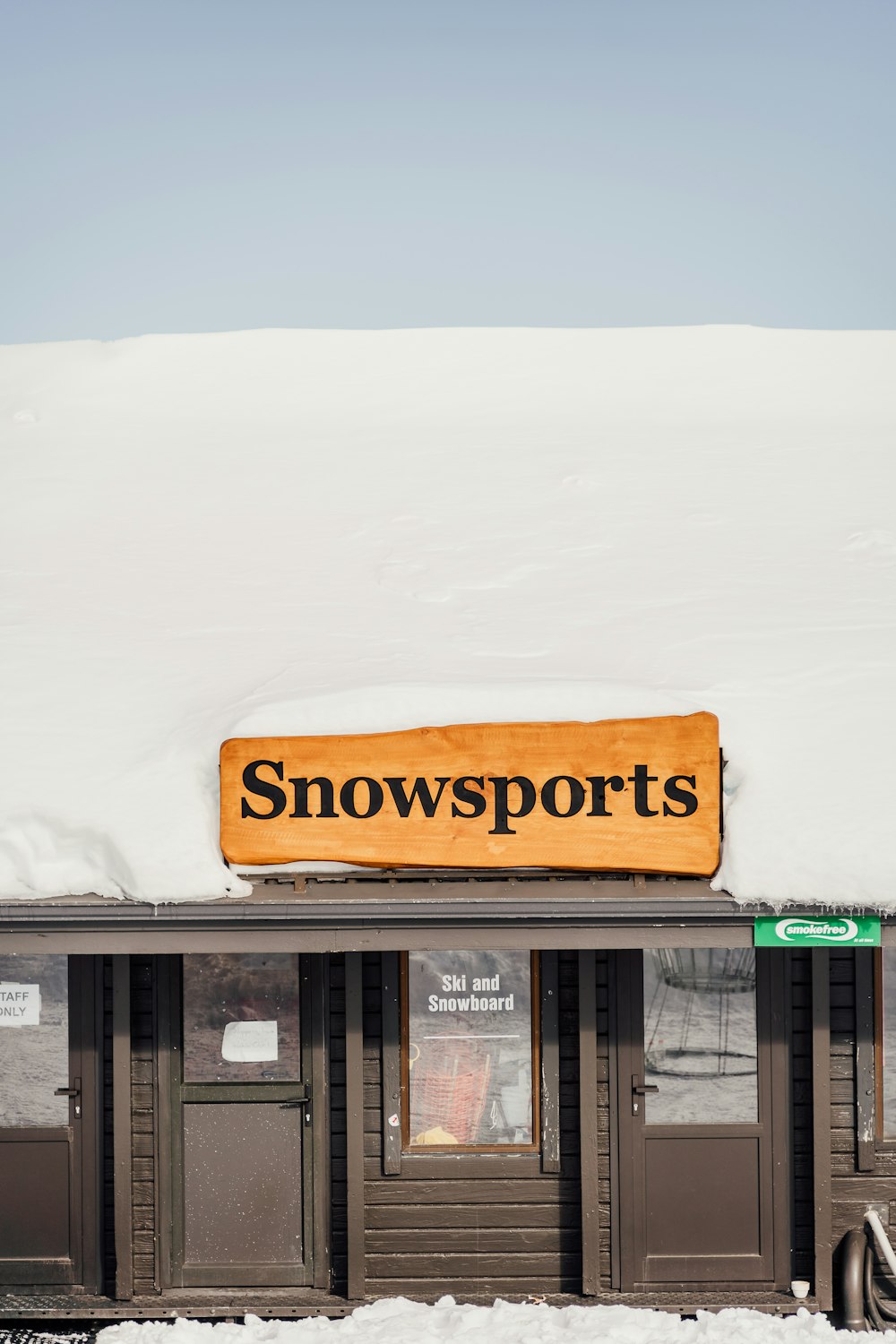 a snow sports store with a sign on the roof