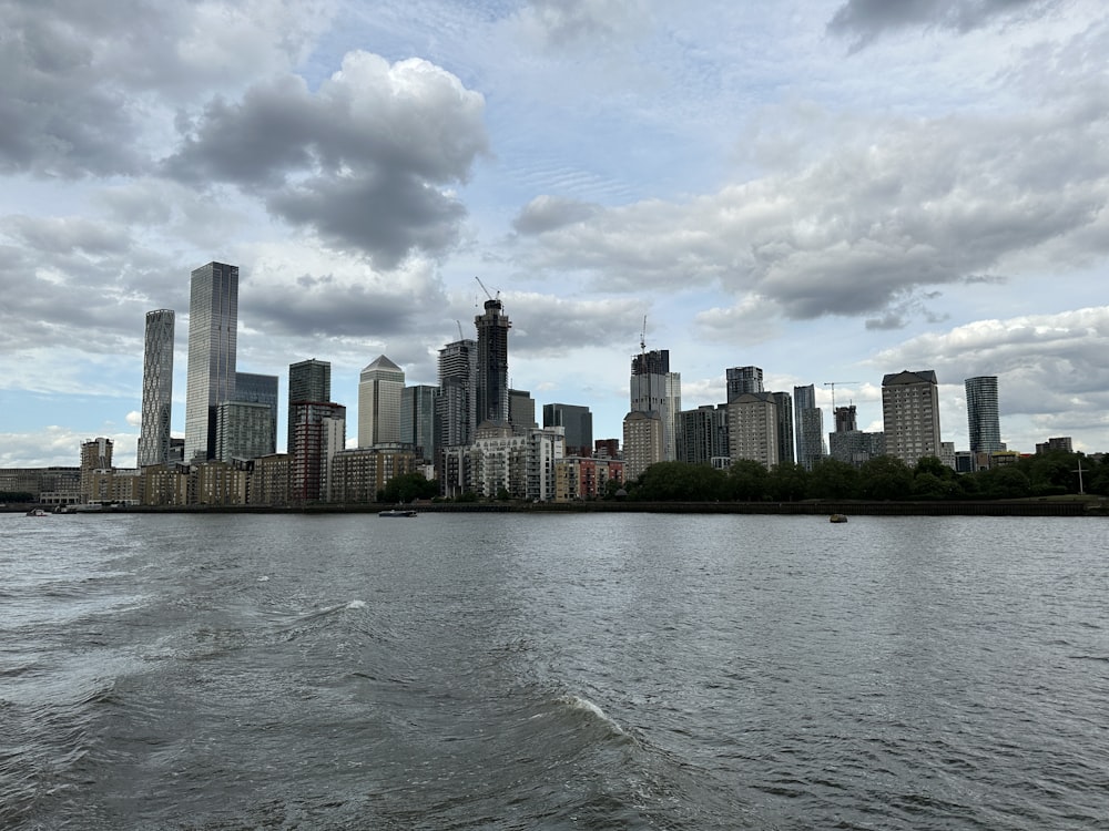 a large body of water with a city in the background