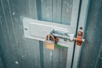 a couple of padlocks are attached to a door