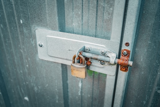 a couple of padlocks are attached to a door