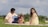 A joyful family enjoying a picnic in a sunny park.