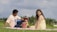 A happy family enjoying a scenic picnic at a national park.