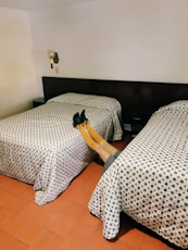 a couple of beds sitting next to each other