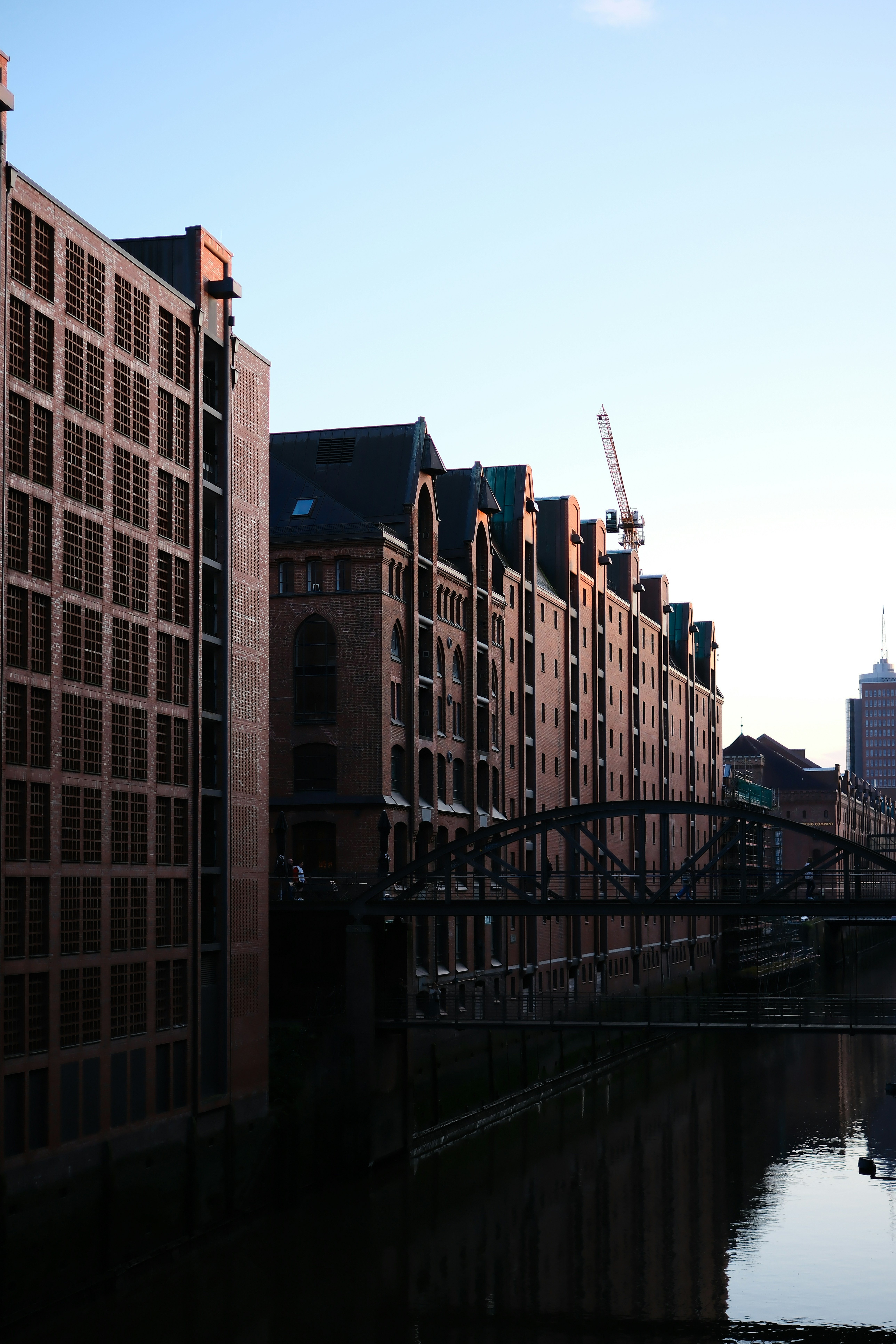 a river running through a city next to tall buildings
