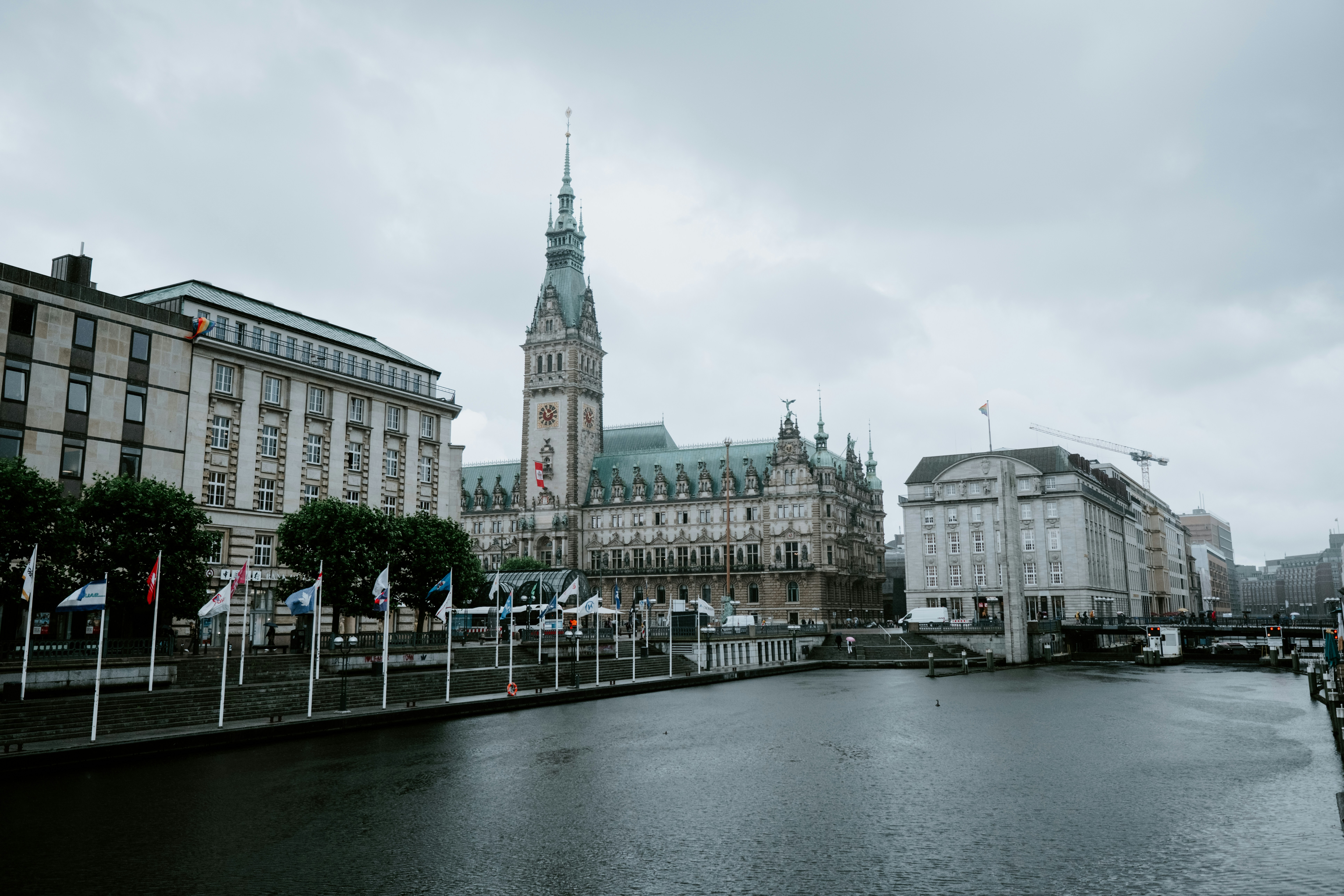 a river running through a city next to tall buildings
