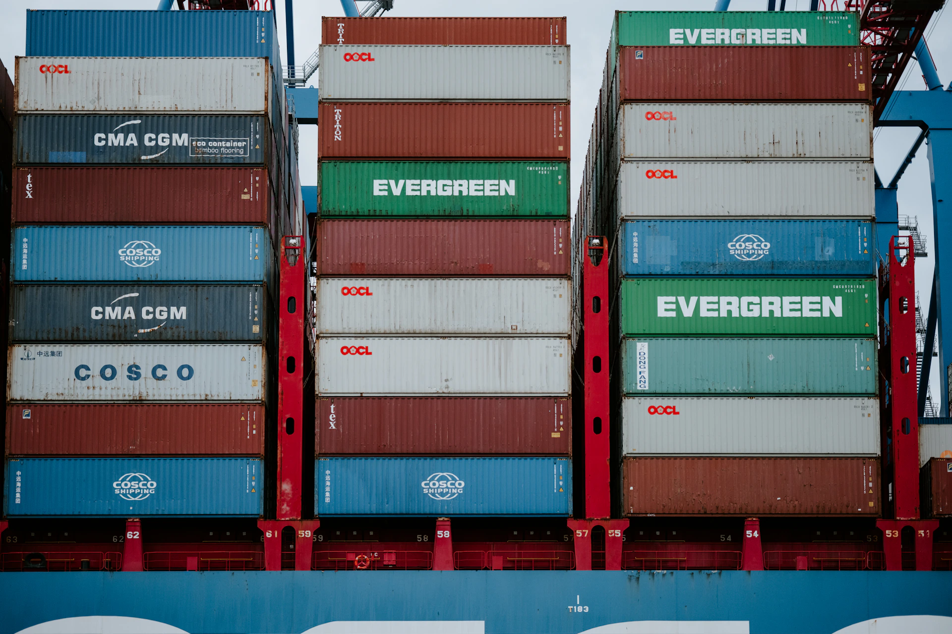 a stack of cargo containers sitting on top of a truck