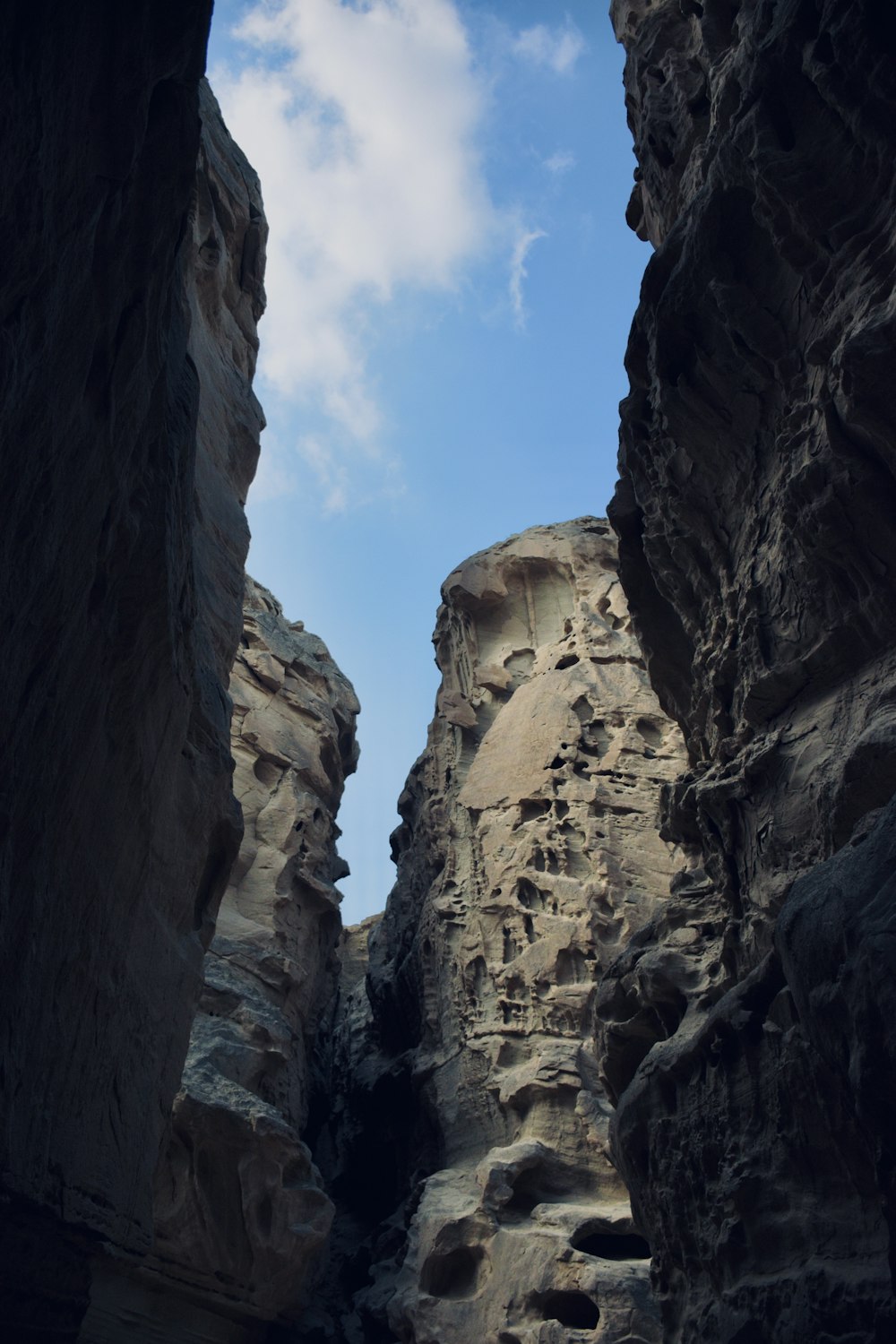 a narrow narrow canyon with a sky in the background
