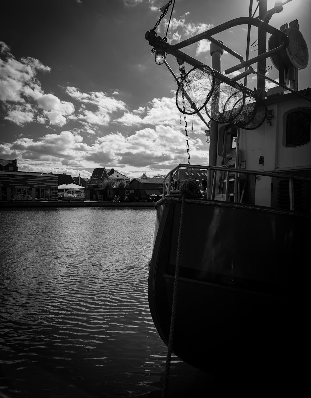 a black and white photo of a boat in the water