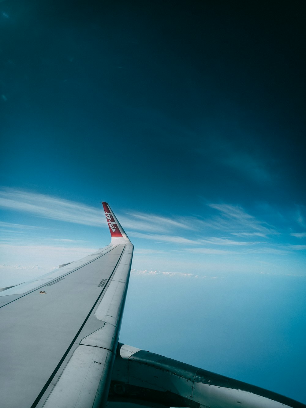 a view of the wing of an airplane in the sky