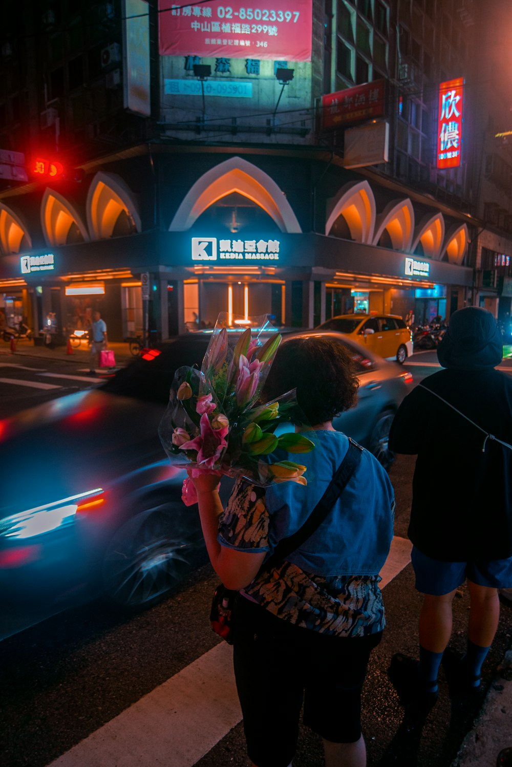 a couple of people that are standing in the street