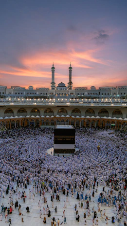 Congregation gathered joyfully under a bright African sky during a Sunday service.
