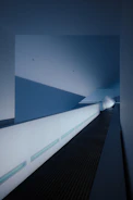 Elegant hallway with smooth surfaces and subtle lighting accents.