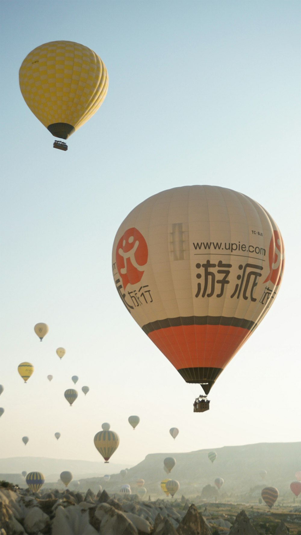 a group of hot air balloons flying in the sky