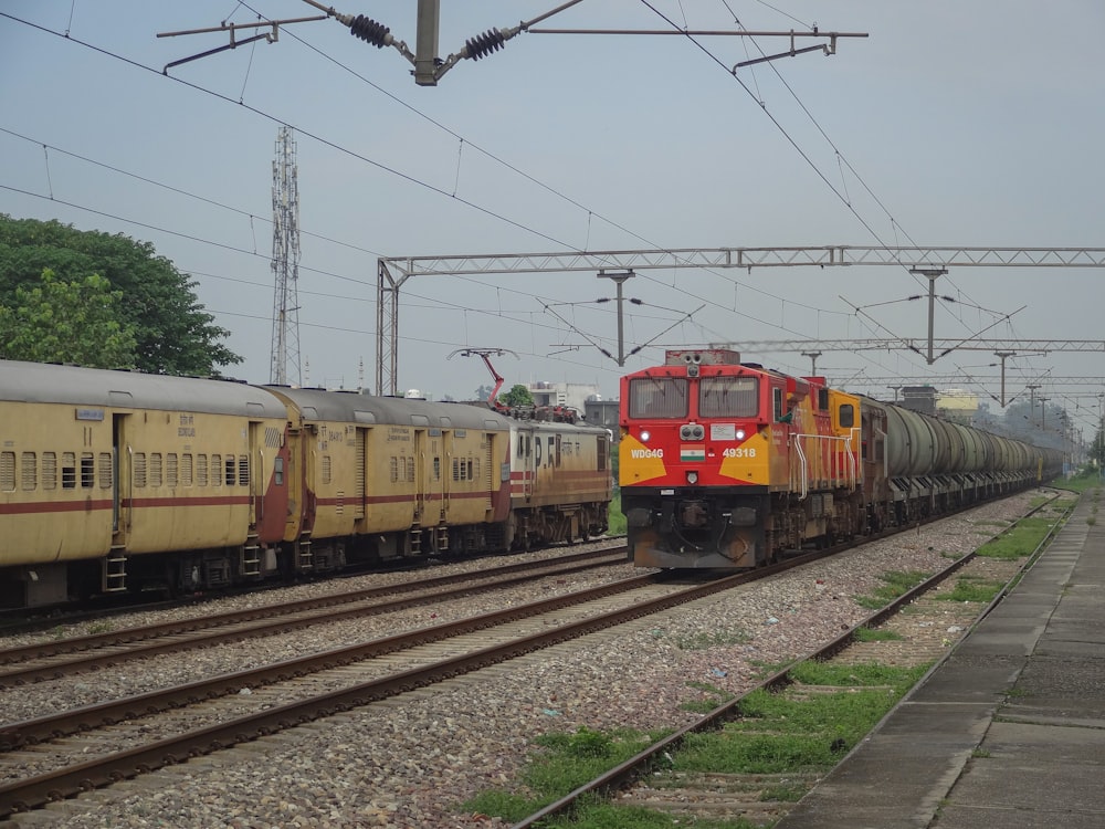 a train on a train track with power lines above