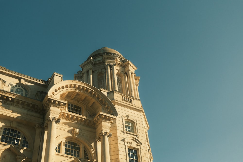 a tall building with a clock on the top of it