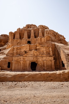 a large stone structure in the middle of a desert