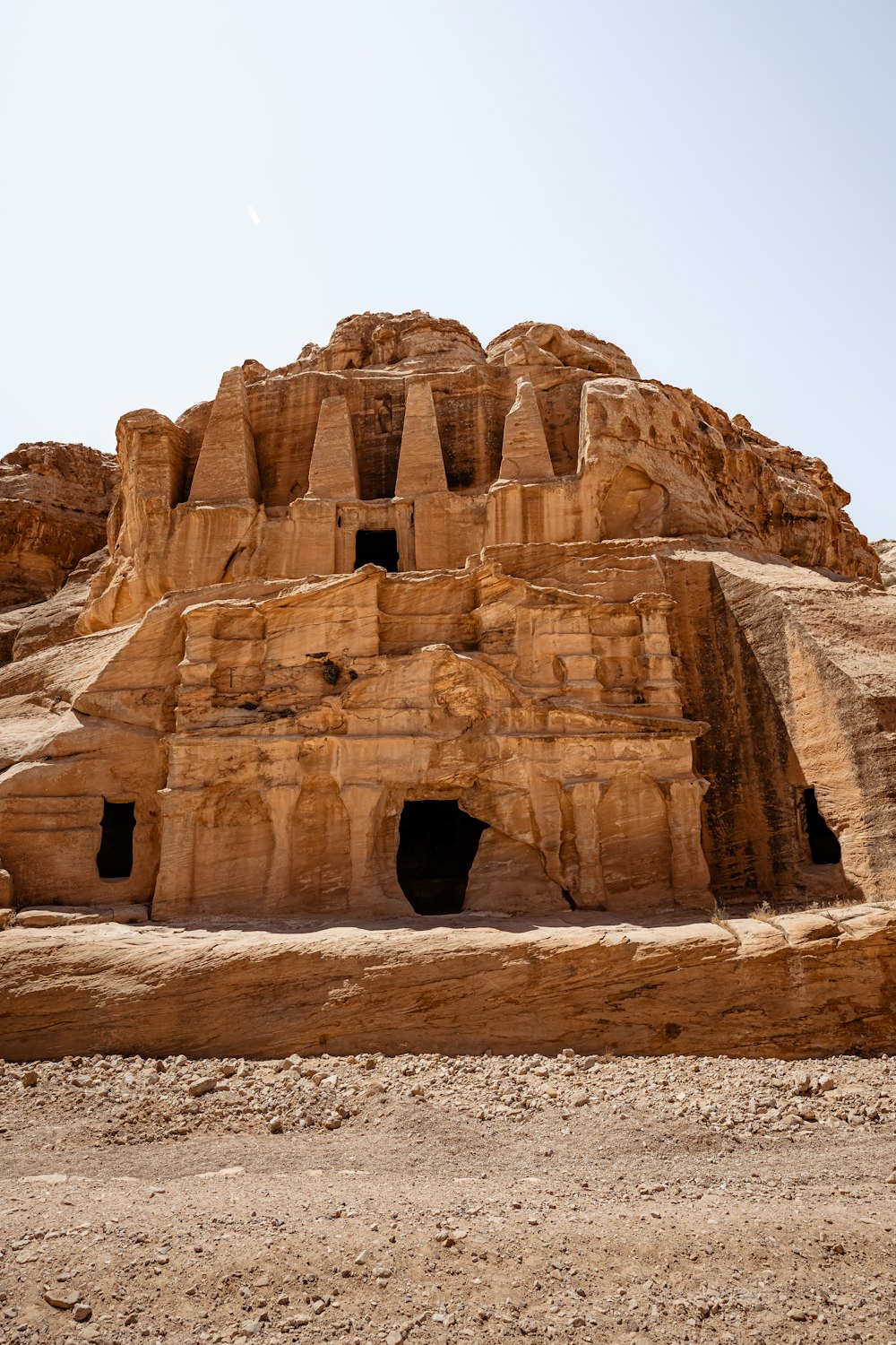 a large stone structure in the middle of a desert