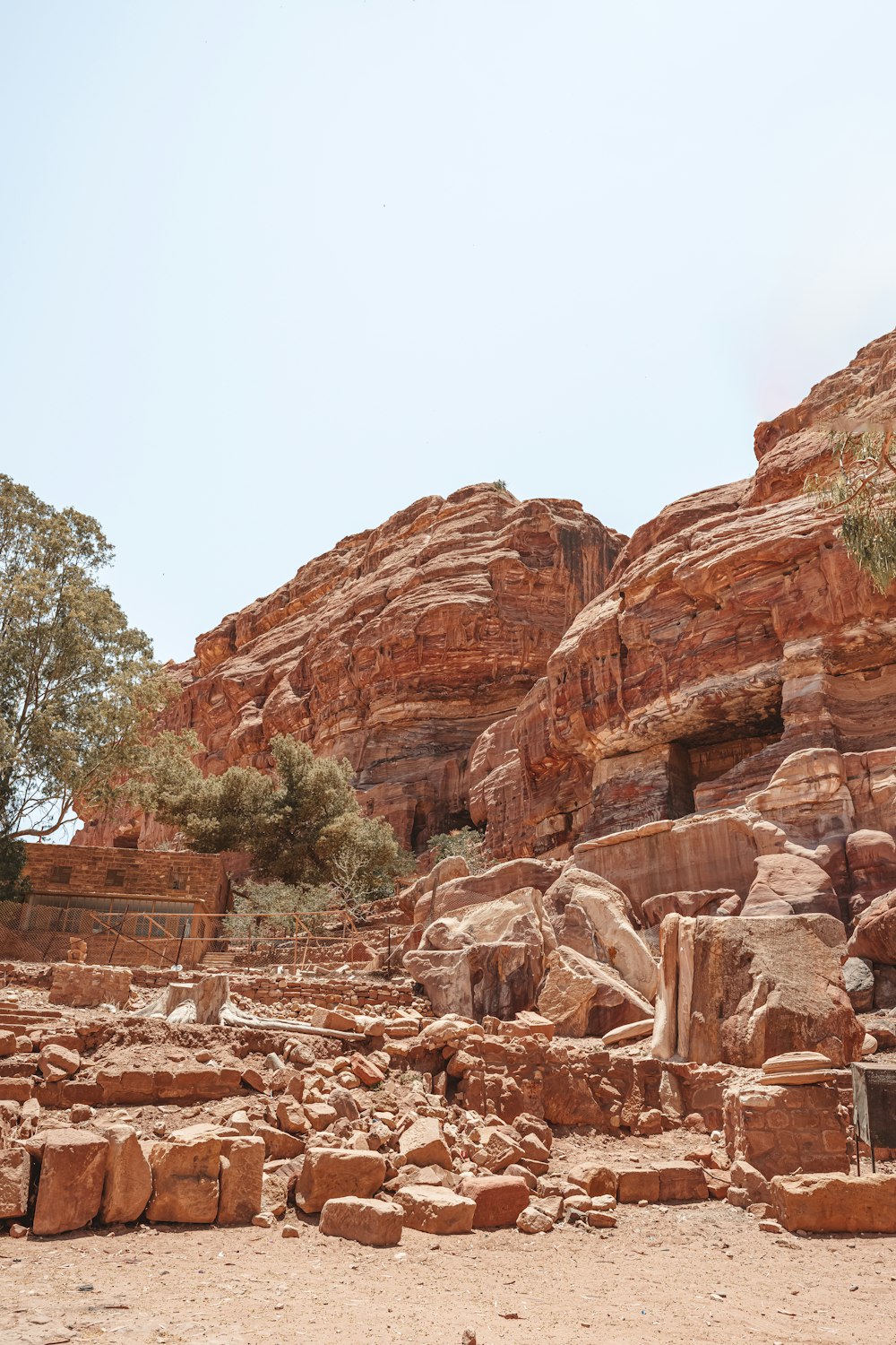 a bench sitting in the middle of a rocky area