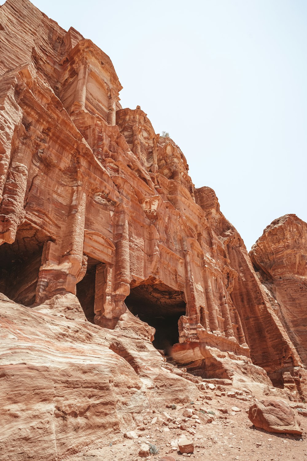 a large rock formation with a cave in the middle of it