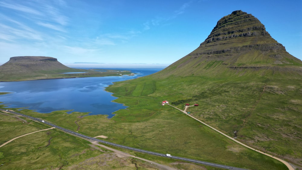 an aerial view of a road and a mountain