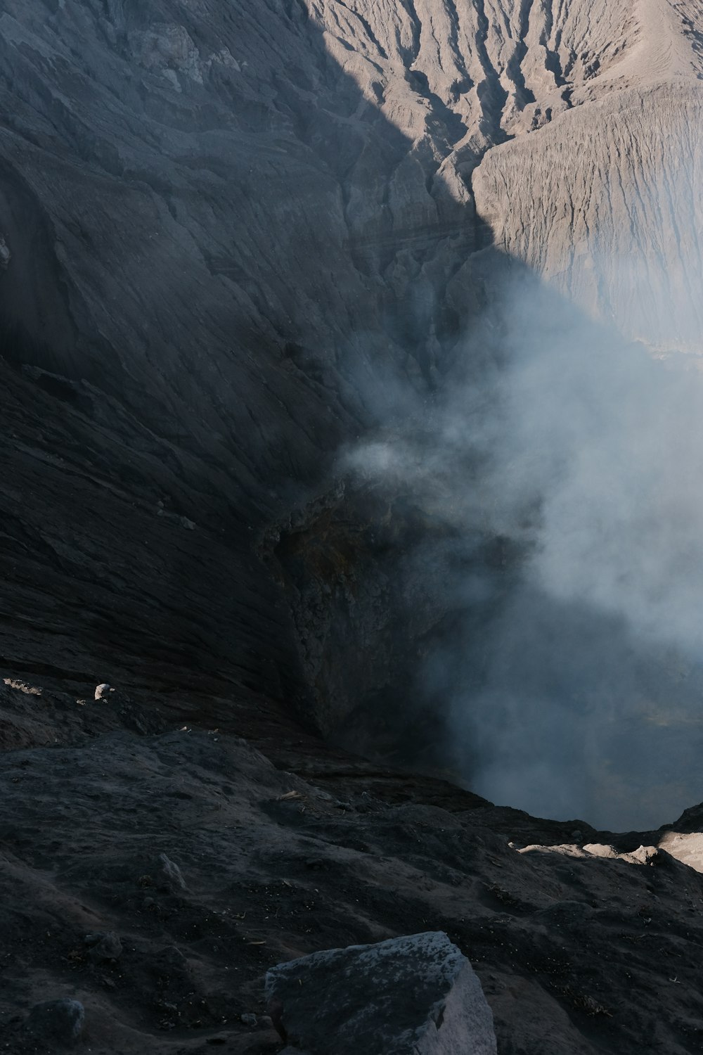 a view of a mountain with steam coming out of it