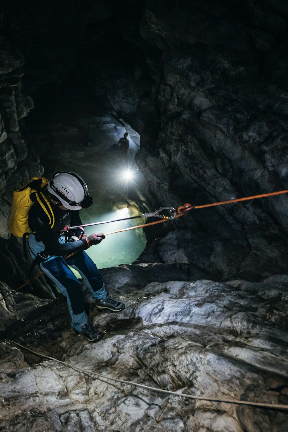 a man climbing up a mountain in a cave