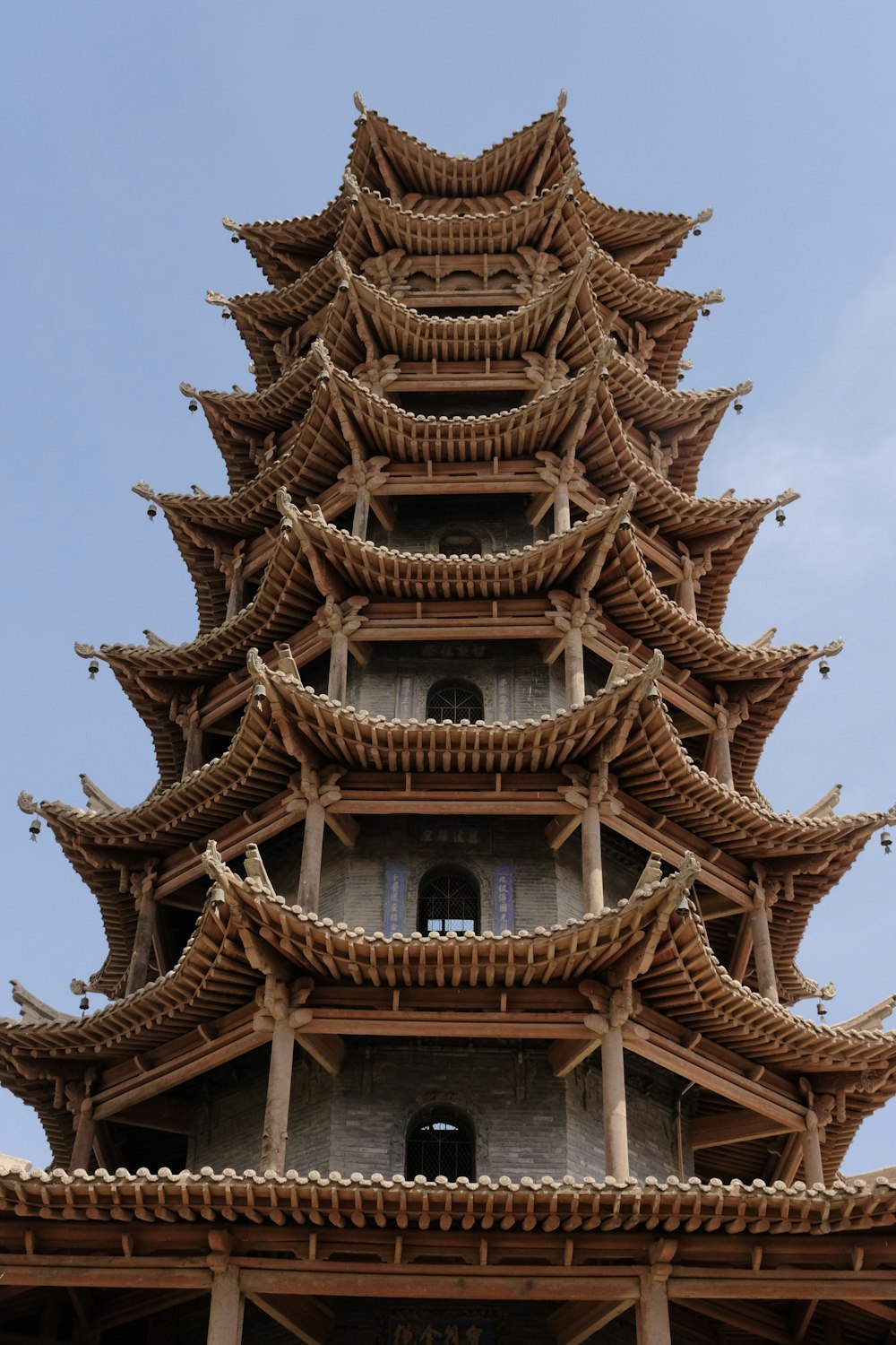 a tall tower with a clock on the top of it